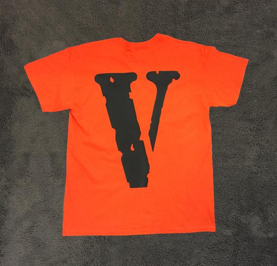 "Vlone Friends Logo Printed T-Shirt: A black tee featuring the iconic Vlone Friends logo, perfect for urban fashion enthusiasts."