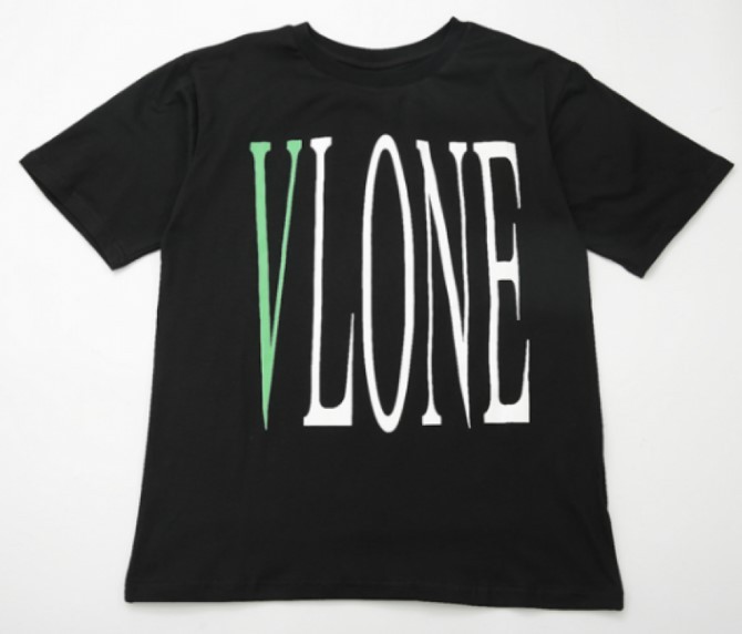 "Vlone Stripe Premium T-Shirt: A black and white striped shirt with the Vlone logo. A stylish and versatile fashion piece."